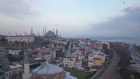 aerial view of istanbul in twilight. evening street traffic with blue mosque and little hagia sophia overview