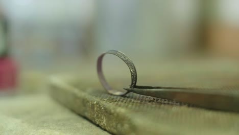 close ups of a craftsman making jewellery in a workshop