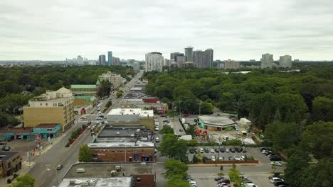 Drone-flying-along-neighborhood-businesses-in-Toronto-suburb