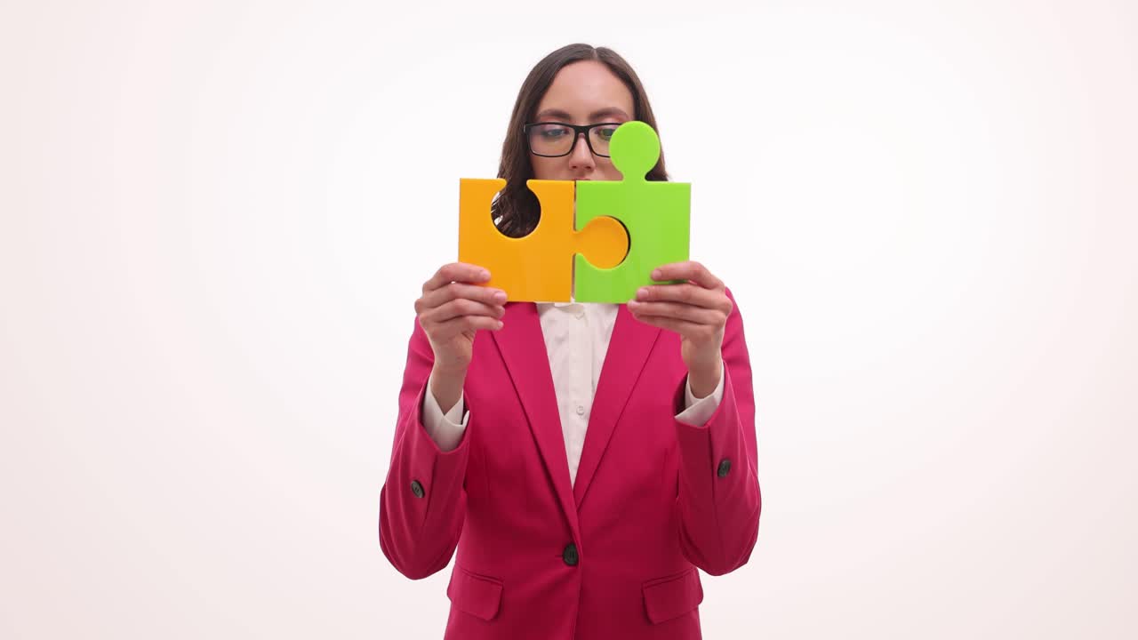 Businesswoman holding puzzle pieces