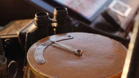 close-up of a vintage nautical measuring instrument with binoculars