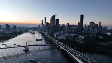 panning aerial shot of brisbane city's goodwill bridge and captain cook bridge expressway pacific motorway