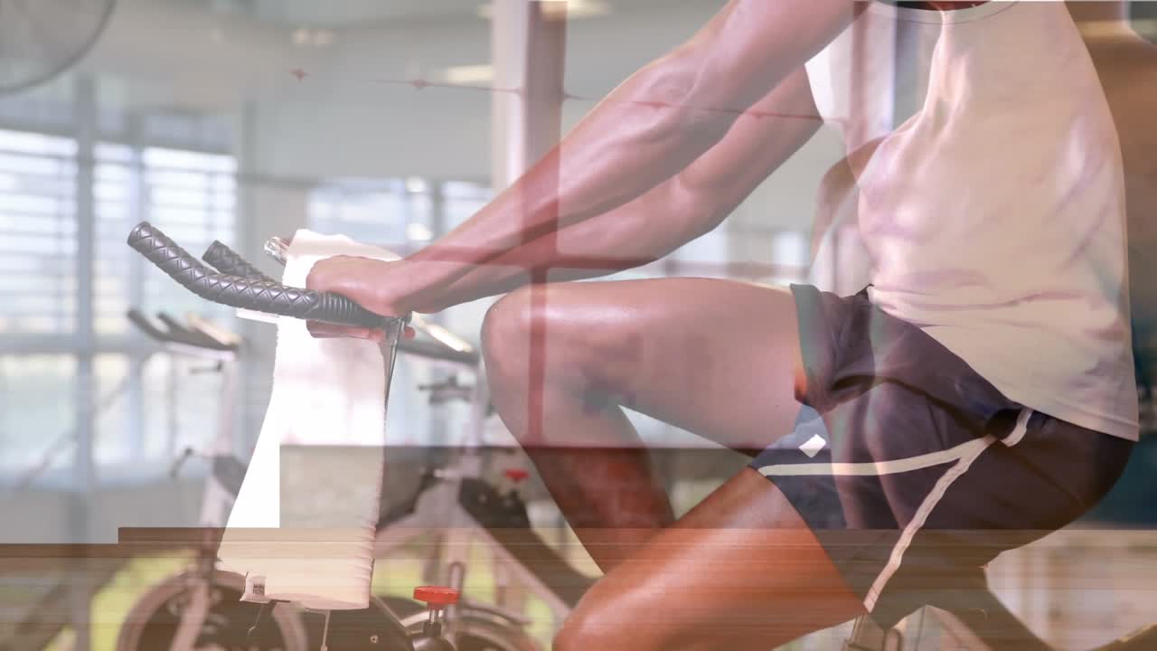 Animation of african american sportsman exercising at gym