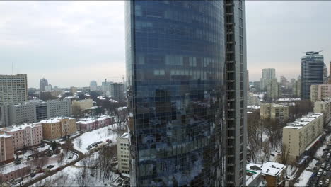 corporate office building in winter city. aerial view glass skyscraper