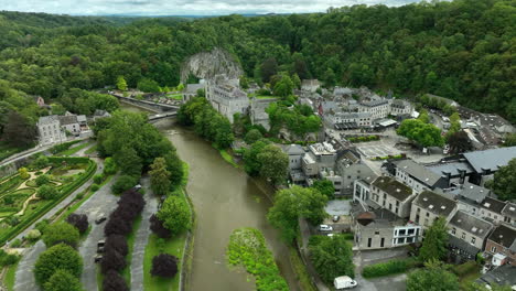 drone arc shot over ourthe river of château de durbuy in city of durby, belgium