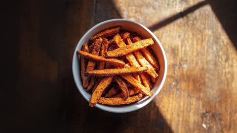 delicious crispy sweet potato fries in white bowl