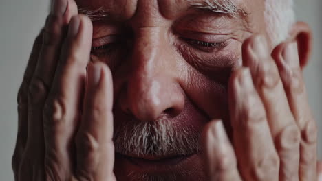 close-up of a senior man suffering