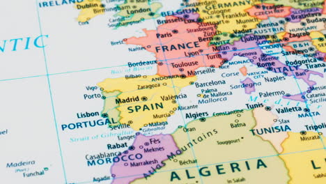 close-up of the country word spain on a world map with the detailed name of the capital city