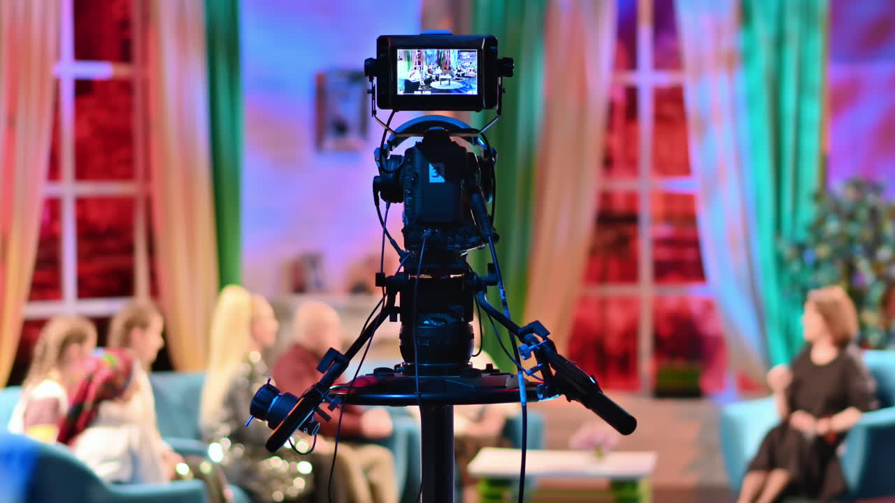 Professional television camera shooting a talk show in a studio. Video production backstage