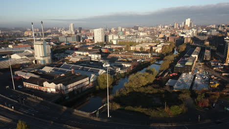 Establishing-Morning-Hyperlapse-of-Leeds-City-Skyline-and-A61-with-Construction-Works-Cranes-and-River-Aire-and-Glass-Factory-in-West-Yorkshire-UK