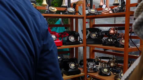 antique telephones on display at outdoor market