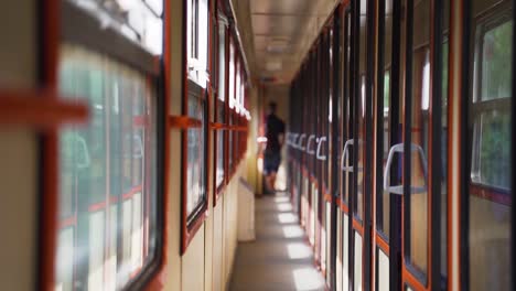 an almost empty corridor of an electric intercity train, slow motion.