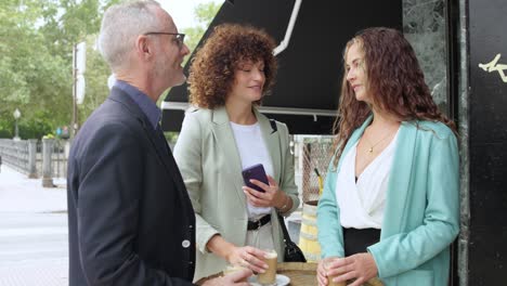 Group of business people chatting in a cafe