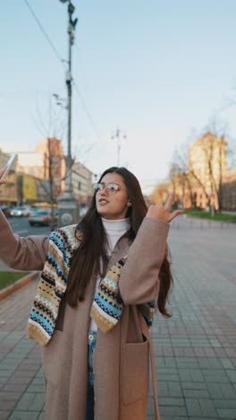 woman taking a selfie in the city