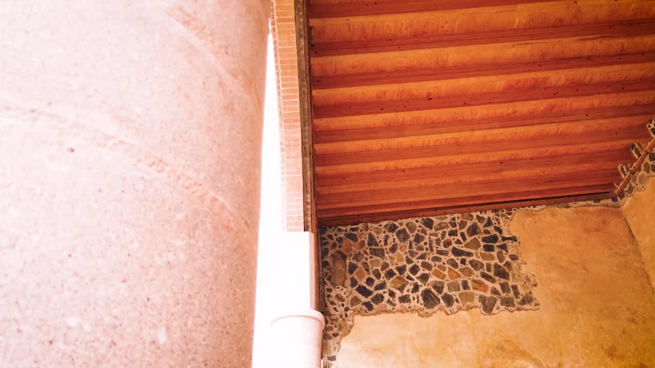 Downward shot of an adjacent space in the atrium of the Ex-Convent of Tepoztlán, covered with wood placed over a stone wall