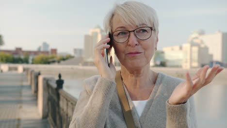 senior woman talking on phone outdoors