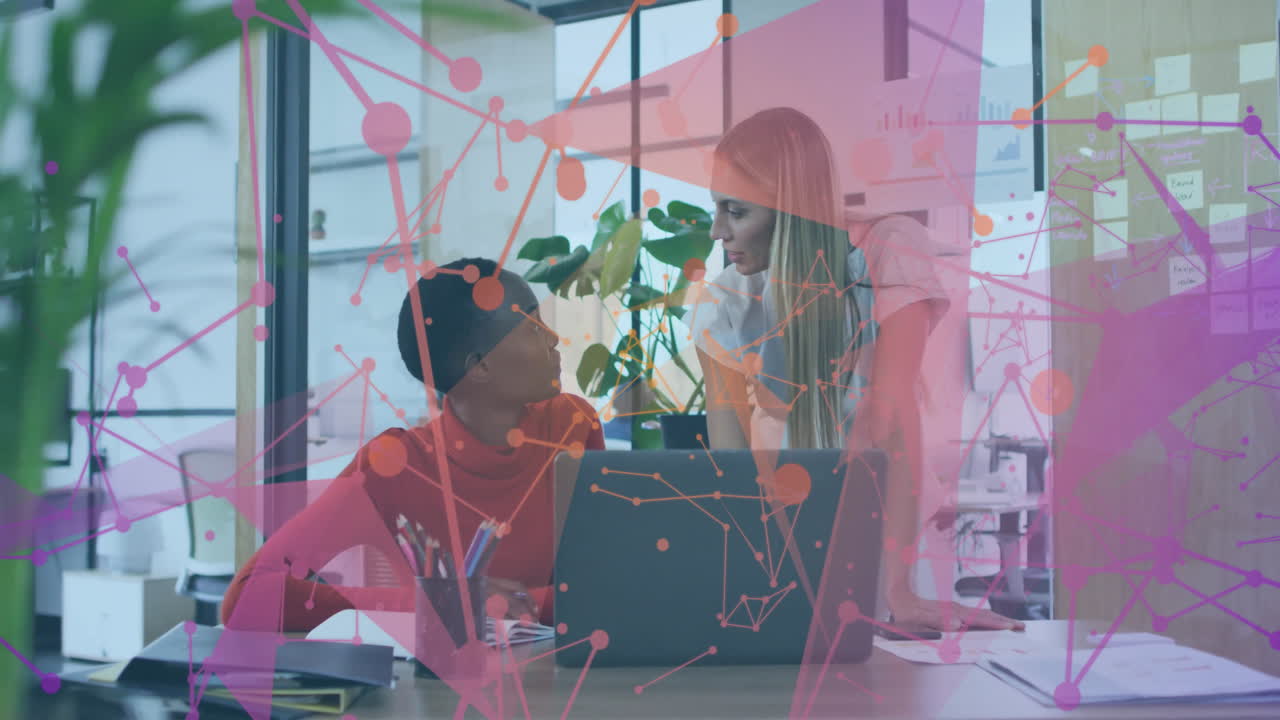 Two colleagues discussing work at office with abstract network animation overlay