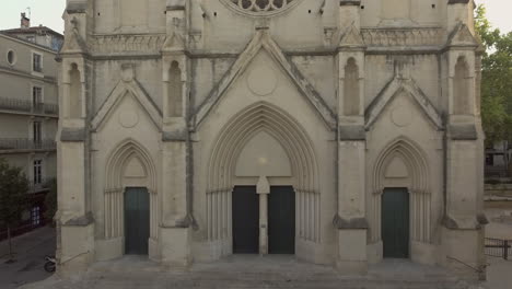 Bottom-to-top-view-of-the-church-Saint-Roch-in-Montpellier,-France.-Sunrise-time