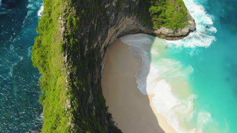 bird's eye view of the nusa penida cliffs and the secret kelingking beach, slow motion footage