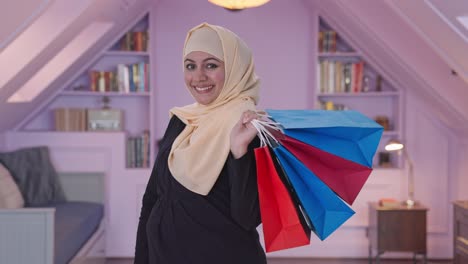 happy muslim woman doing shopping