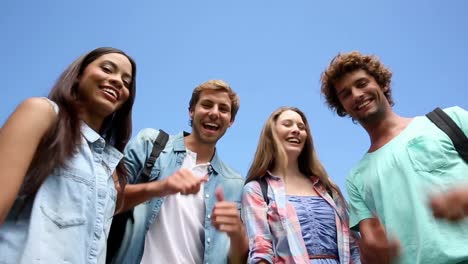 happy students standing outside chatting