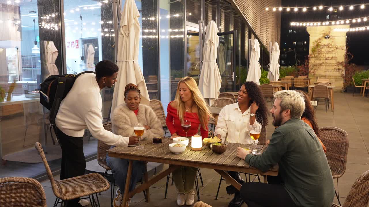 Group of Friends Enjoying an Evening at an Outdoor Restaurant
