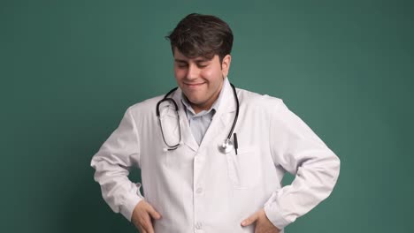 happy young female doctor celebrating victory in studio