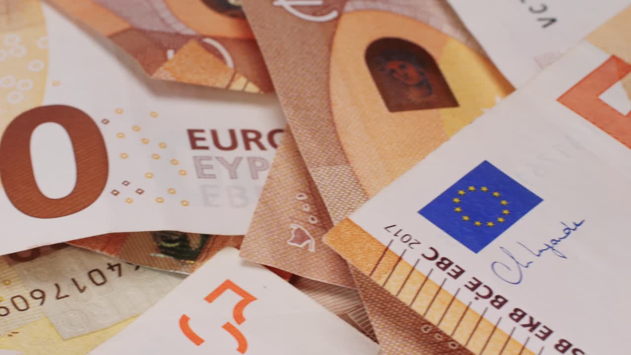 Fifty euro banknotes close-up. European currency EUR, EU Central Bank. 50 euro money macro. Economy, financial and banking concept in European union.