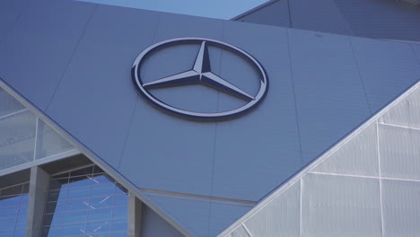 mercedes-benz stadium overlooks the downtown atlanta cityscape.