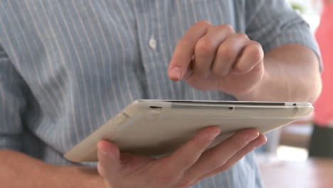 man using a tablet pc in the office