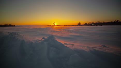 cinematic sunset view through snow covered mountain landscape, time-lapse