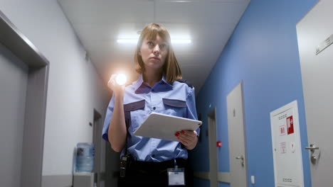 woman in uniform searching on the hallway