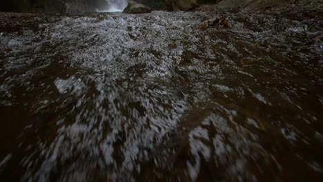 Reveal-Shot-of-a-Woodland-Waterfall