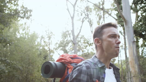 trekking guy drinking fresh water on his way to the campsite