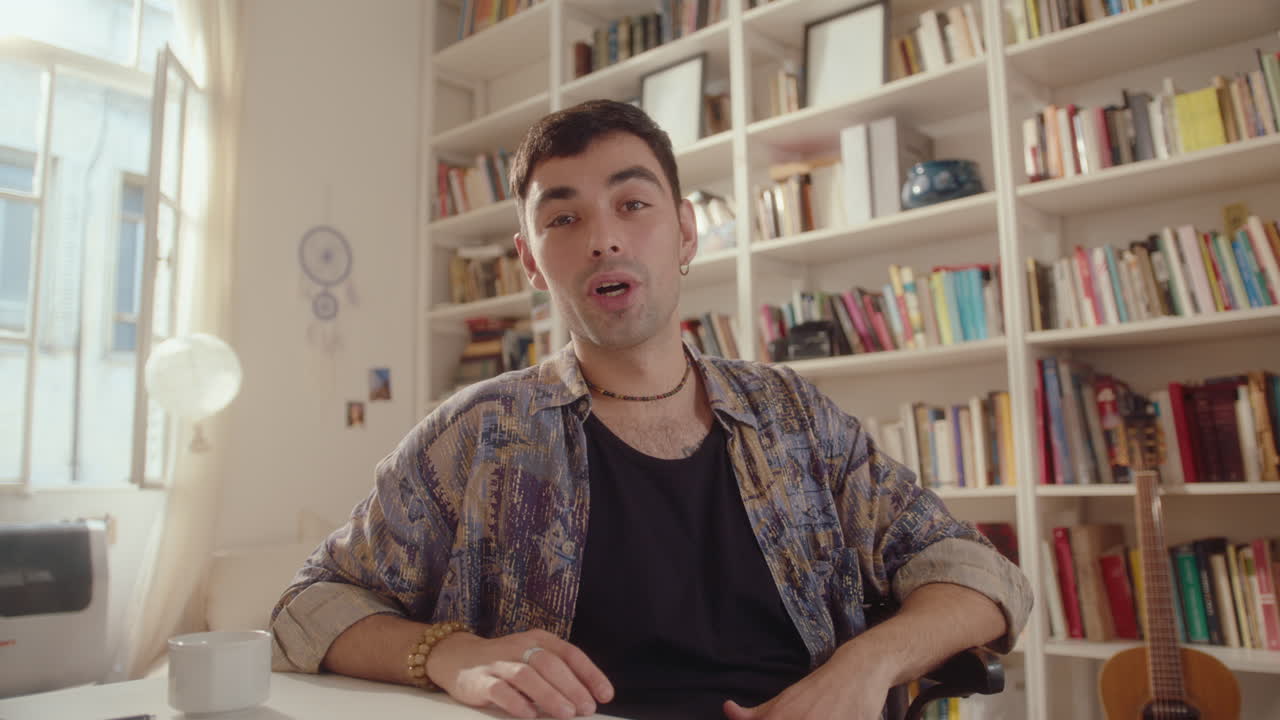 Young Man Filming Lifestyle Vlog or Video Calling at Home