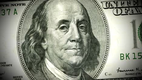 benjamin franklin looking suspicious on the us 100 dollar bill - seamless looping.