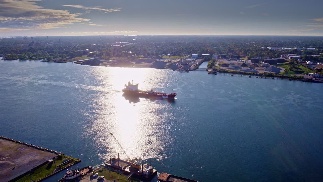 Smooth cinematic drone fly-around of the international crossing between Canada and the U.S