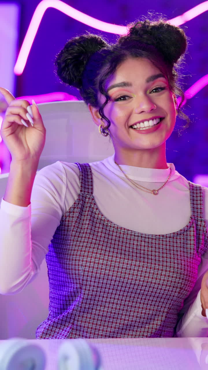 Portrait of a woman with curly hair in a plaid dress