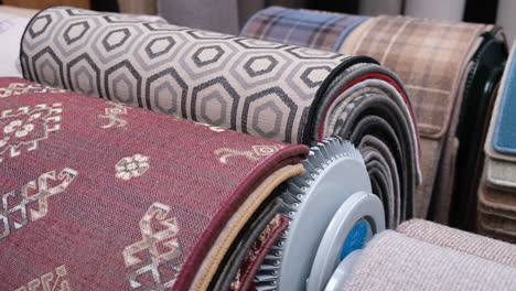 customer looks through some carpet samples in a carpet shop