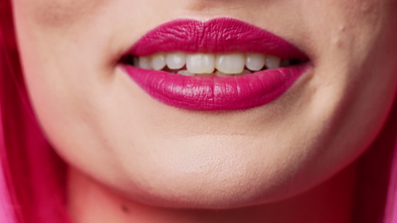 Cheerful female model showing candid smile in studio