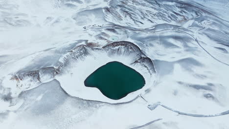 krafla mountain and volcanic caldera during winter in iceland - aerial shot