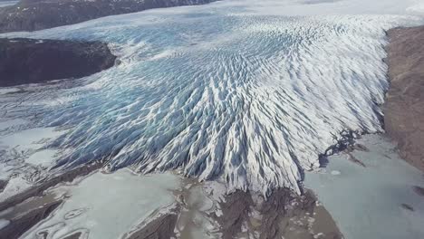 aerial: close up of largest glacier in europe vatnajokull. beautiful glaciers flow through the mountains in iceland. concept of global warming skaftafell glacier, vatnajokull national park in iceland.