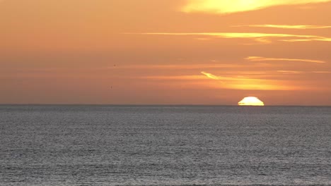 time lapse of the sun setting over the ocean in cascais