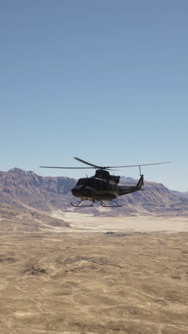 helicopter flying over desert