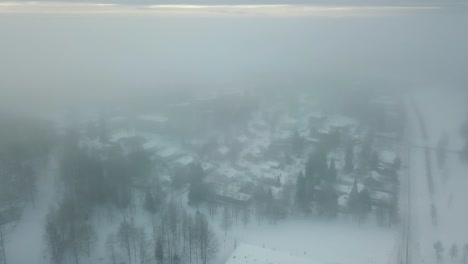 winterwonderland aerial footage with snow covered houses and parks