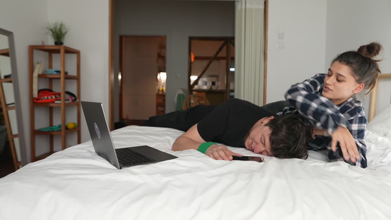 Couple relaxing on a bed