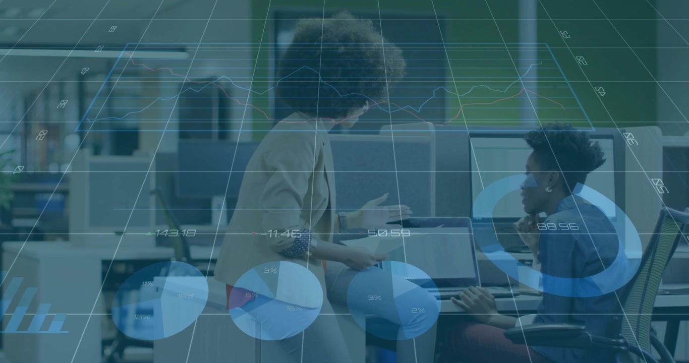 standing woman showing tablet animating graph on peer screen as colleague marking business trends
