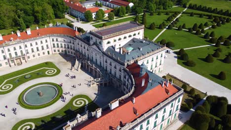 esterhazy castle with visitors on sunny day in fertod, hungary