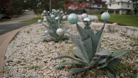 christmas ornament decoration baubles on agave plants in texas neighborhood, slow motion