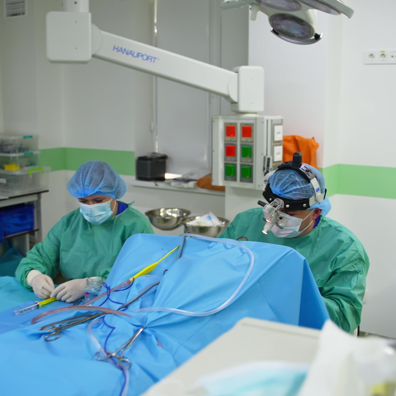 Leaving the operational theatre with surgery in progress. Medical team working with patient in modern surgery room